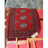 A Bokhara style rug. 65 x 103