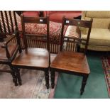 A pair of Regency mahogany dining chairs with plank seats