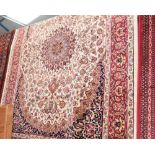 A Keshan style rug with beige ground. 1.90 x 1.40