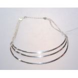 A modernist silver three band necklace, stamped 925