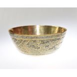 A Chinese polished bronze bowl decorated with dragon and bird on a stylised wavy background, with