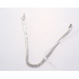 A diamond tennis bracelet mounted in 18ct white gold. Diamonds 4ct