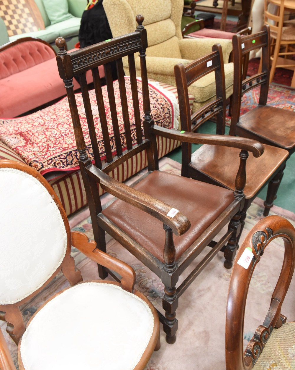 A 19th century oak framed open armchair in 18th century style