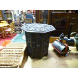 A small carved oak folding occasional table