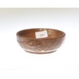 A Robert Mouseman Thompson oak nut bowl, adzed and with carved mouse signature. Diameter 15cm