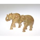 A pair of carved soapstone elephants