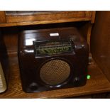 A 1950's Bush bakelite cased radio with twin dials