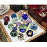 A tray of seventeen paperweights