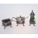 A silver cruet set comprising a square shaped mustard pot & salt cellar with blue glass liners and a