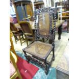 A 19th Century carved mahogany hall chair with cane-work back and seat