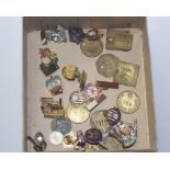 A collection of ten brass Colliery tags, a silver jubilee badge for 1910-1935, a Royal British