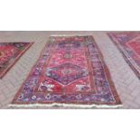 A vintage Persian Heriz carpet. 316 x 160