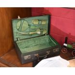 A 1930s ladies dressing case fitted with a set of bakelite backed  brushes and comb