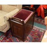 An Edwardian mahogany piano stool with fall-out compartments