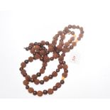 A Chinese wooden bead necklace, 76cm long