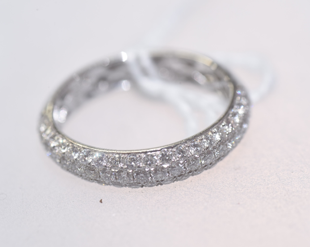 A diamond half hoop eternity ring on an 18ct white gold band. 0.85ct. Ring size O