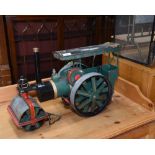 A vintage painted metal steam roller model