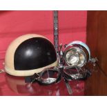 A Lambreta scooter mascot, a Lucas headlight, a Vintage motorcycle helmet and goggles