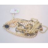 A group of faux and cultured pearl necklaces including a triple strand choker, single strand set