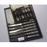 A boxed set of silver coffee spoons, Sheffield 1943, a boxed set of silver handled tea knives,