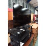 A Samsung flatscreen tv and stand