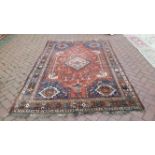 An antique Persian Qashqai rug. 262 x 173