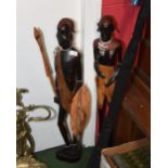 Two African carved wooden tribal figures of Masai warriors
