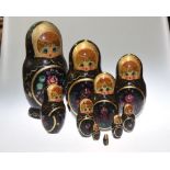 A 20th century wooden Russian Doll with ten graduted dolls