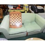 A sofa bed; tog. with a chess board