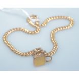 A 9ct gold watch chain with plain seal fob, approx weight 32g