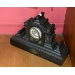 A 19th Century slate mantle clock of Architectural form, the movement striking on a bell