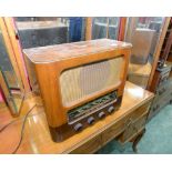 A G. Marconi radio in wooden case and with four bakelite tuning knobs,