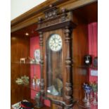 A mahogany cased Vienna wall clock