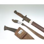 A 20th Century Gurkha kukri in leather sheath, an Indian dagger with hardwood carved handle and a