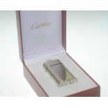 A cased Cartier cigarette lighter