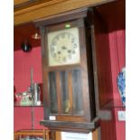 A 1920s oak wall clock