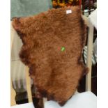 A dyed sheepskin rug