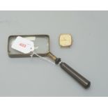 A Vintage magnifying glass with brass mount and turned handle together with a Solvil et Titus quartz