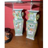 A pair of large Chinese famille rose style vases of rectangular form with pierced handles and