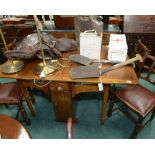 A 1920s oak dropleaf dining table; tog. with a set of four chairs