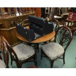 An oak table and four bentwood chairs