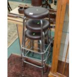 A set of three chrome framed stools