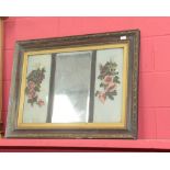 A Victorian parcel gilt framed mirror with floral painted glass panels