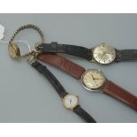 A group of four vintage wristwatches