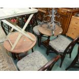 A pair of hammered copper topped tables and four bentwood chairs