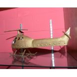 A gilt painted metal helicopter