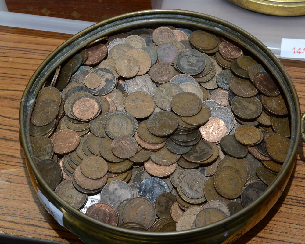 A 19th century brass pan containing a large quantity of GB low denomination coins