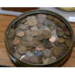 A 19th century brass pan containing a large quantity of GB low denomination coins