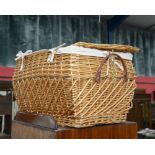 A wicker bombe form wicker hamper