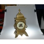 A 19th century brass French mantle clock. The eight day Marti movement striking on a gong, with